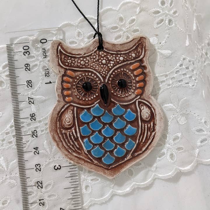 Handmade ceramic owl ornament brown with blue and orange for wholesale by CurlyFernCeramics
