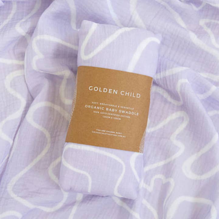 The Laze Organic Cotton Baby Swaddle - Lilac for wholesale on Faire