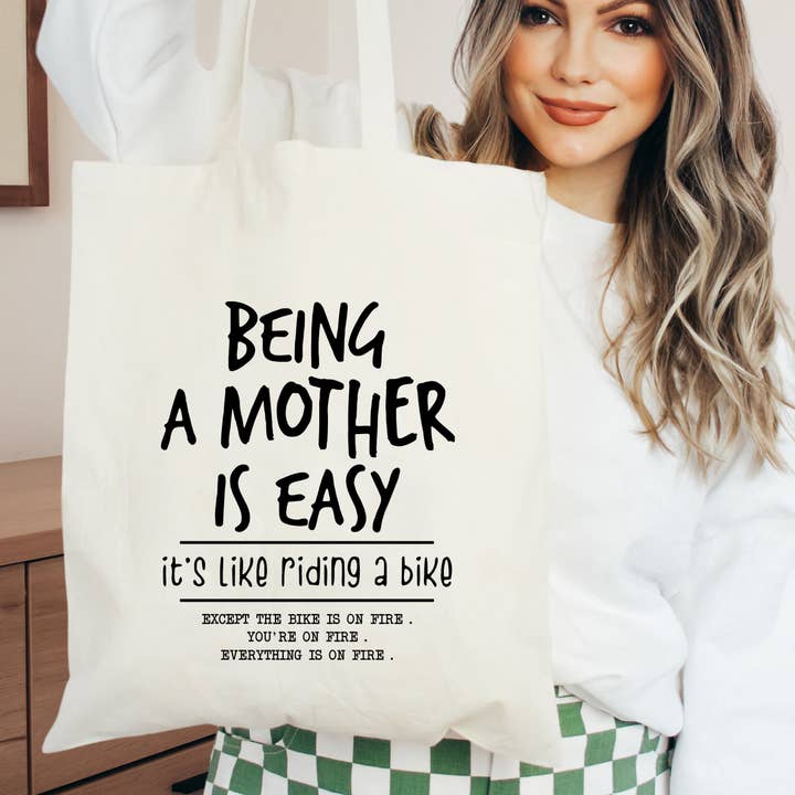 Natural Being A Mother Is Easy | Tote Bag for wholesale on Faire