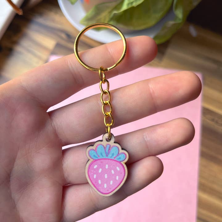 Pink Strawberry Wooden Keychain for wholesale by Rowan Kingsbury