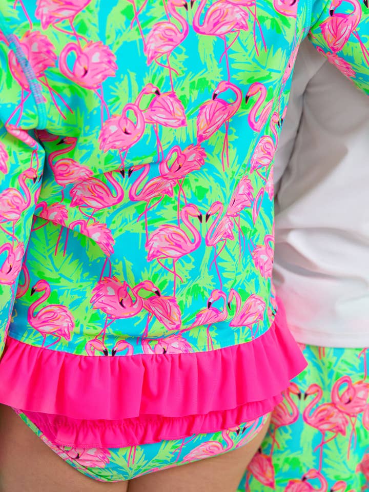 Blue Girls Neon Flamingo Fun Long Sleeve Rash Guard 2-Piece Swimsuit with Signature Rear Ruffles
for wholesale on Faire7