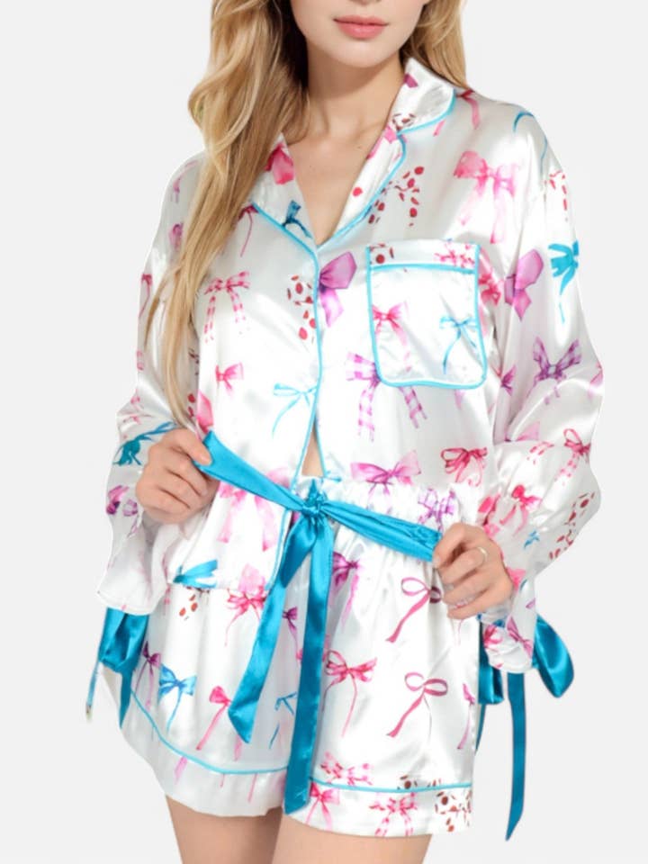Holiday Bow Print Pajama Set with Ribbon Tie and other Purchase Wholesale bow pjs. Free Returns & Net 60 Terms on Faire trending on Faire.