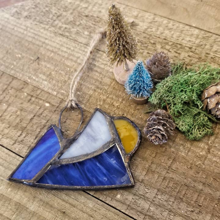 Stained glass mountain and sun ornament for wholesale by Lost & Found Design
