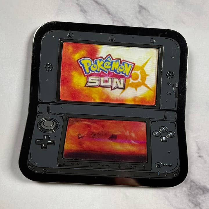 3DS 2.5" Lenticular Pokemon Sun Pin for wholesale by GoopyGoblins