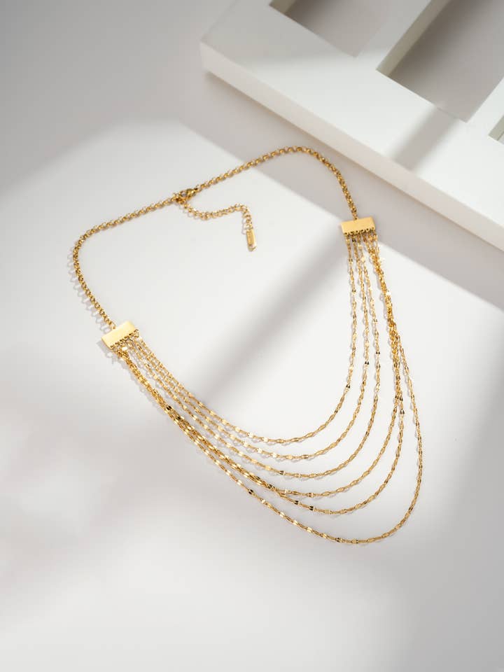 Multi-strand gold necklace in stainless steel with chains for wholesale by COSMOS