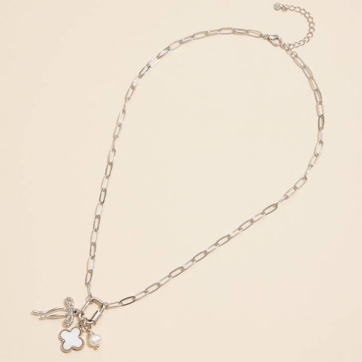 Gold Dipped Bow Charm Necklace with Clover and Pearl for wholesale on Faire