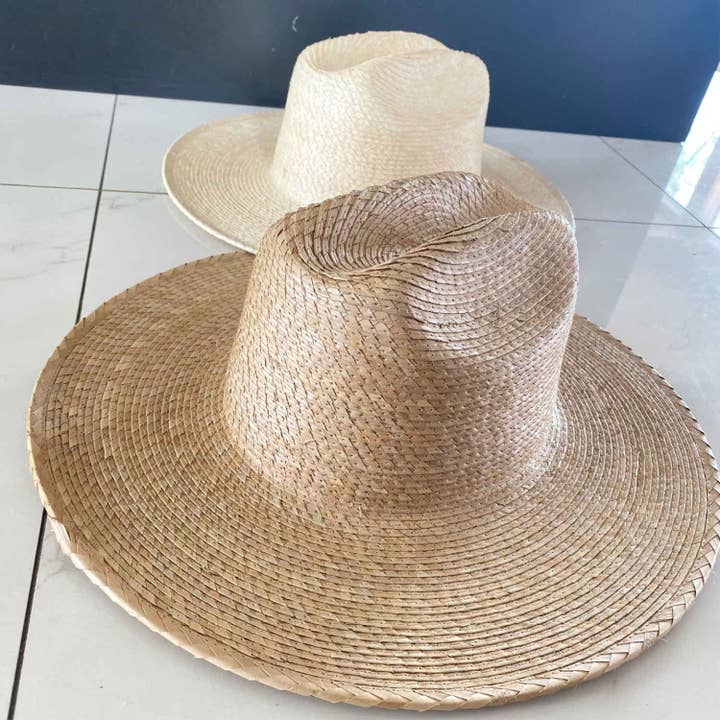 Flat brim cowboy hat in natural palm leaf straw for wholesale by Bella Betty