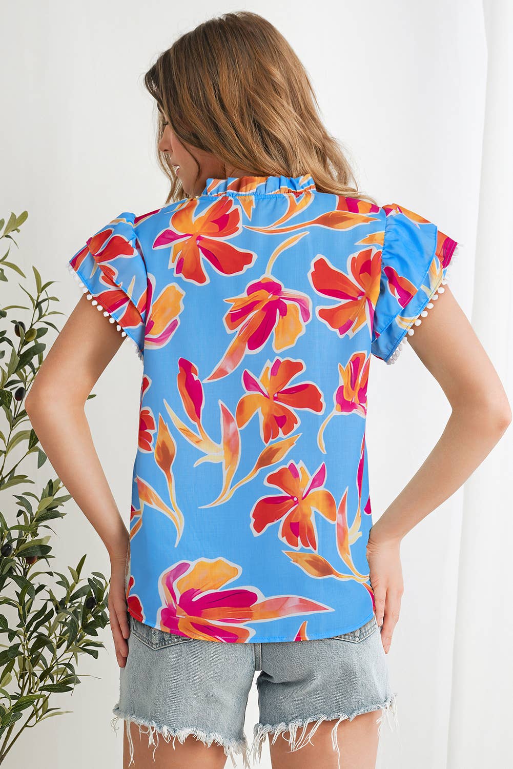 As shown Floral Print V Neck Pompom Trim Flutter Sleeve Blouse | S-XL for wholesale on Faire1