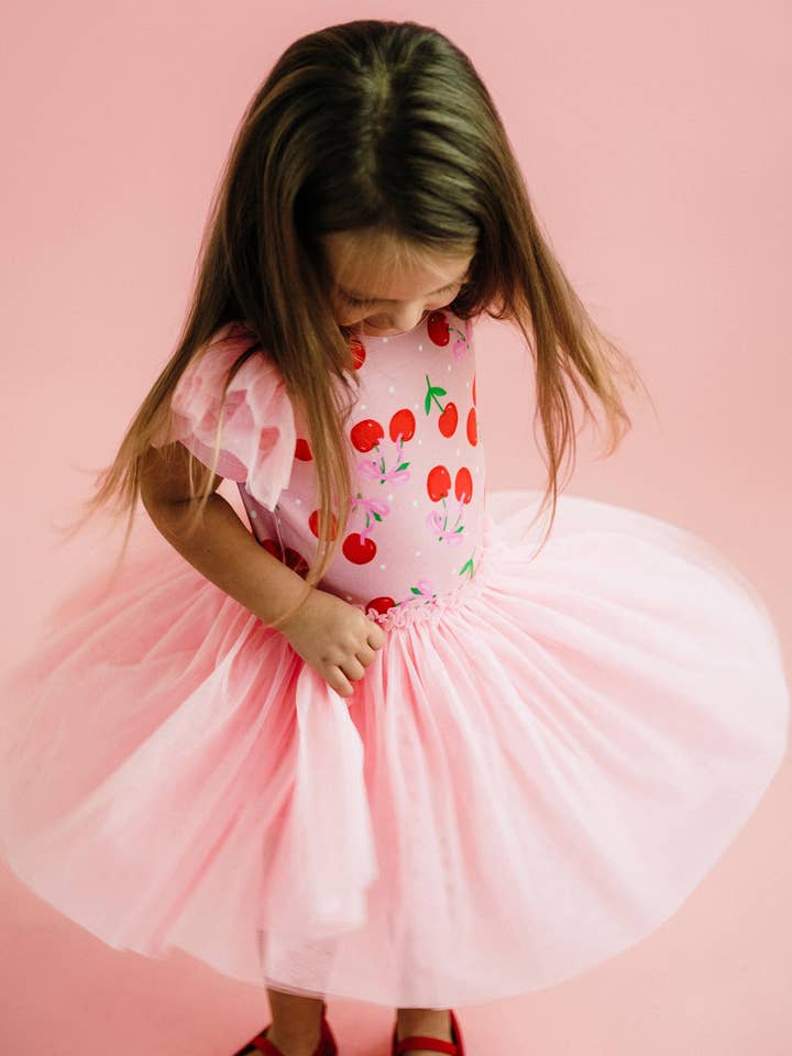Pink POLKA CHERRY SHORT SLEEVE CIRCUS FRILL DRESS for wholesale on Faire1