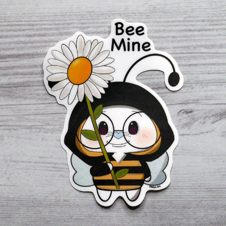 Ben-E Bee Mine holding a Daisy Vinyl Sticker for wholesale by Miyo Art Design