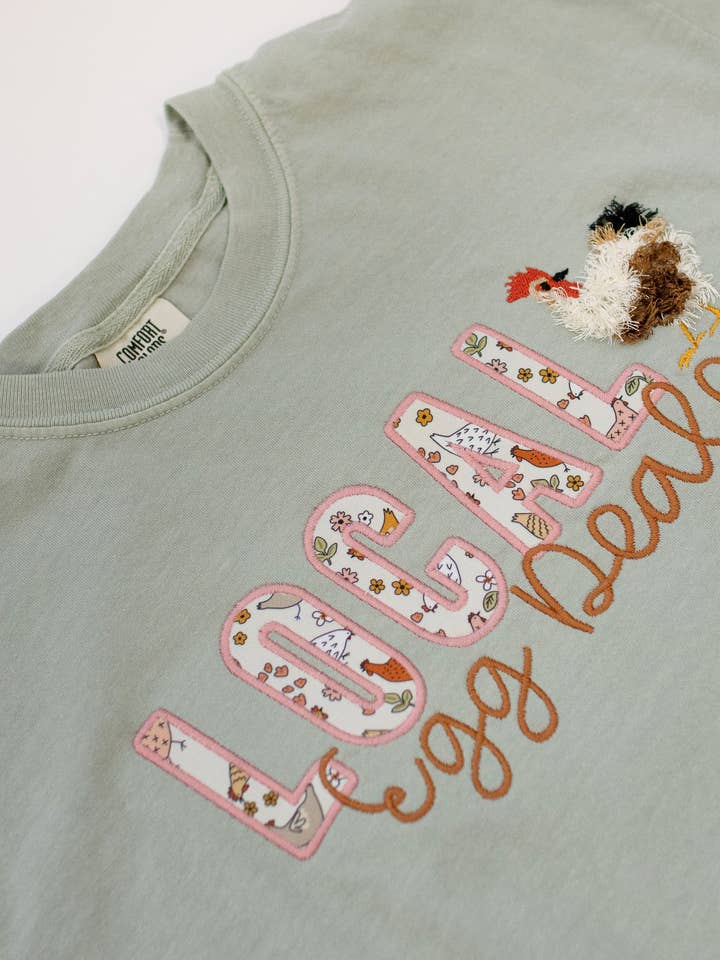Local Egg Dealer Embroidered Tee for wholesale by Ireland’s Bowtique