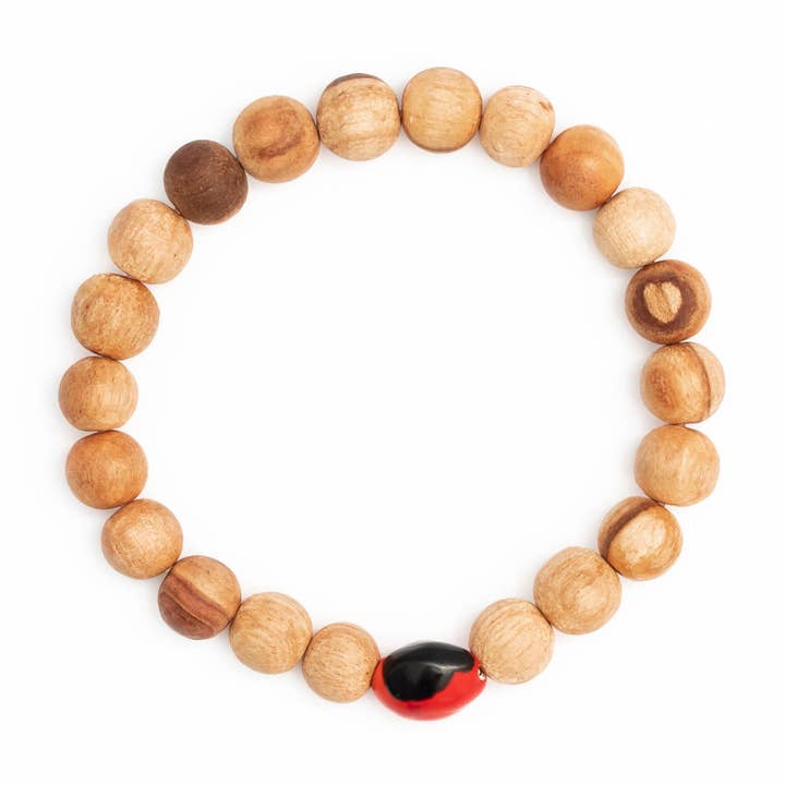 Palo Santo and Huayruro Bracelet for wholesale by Luna Sundara