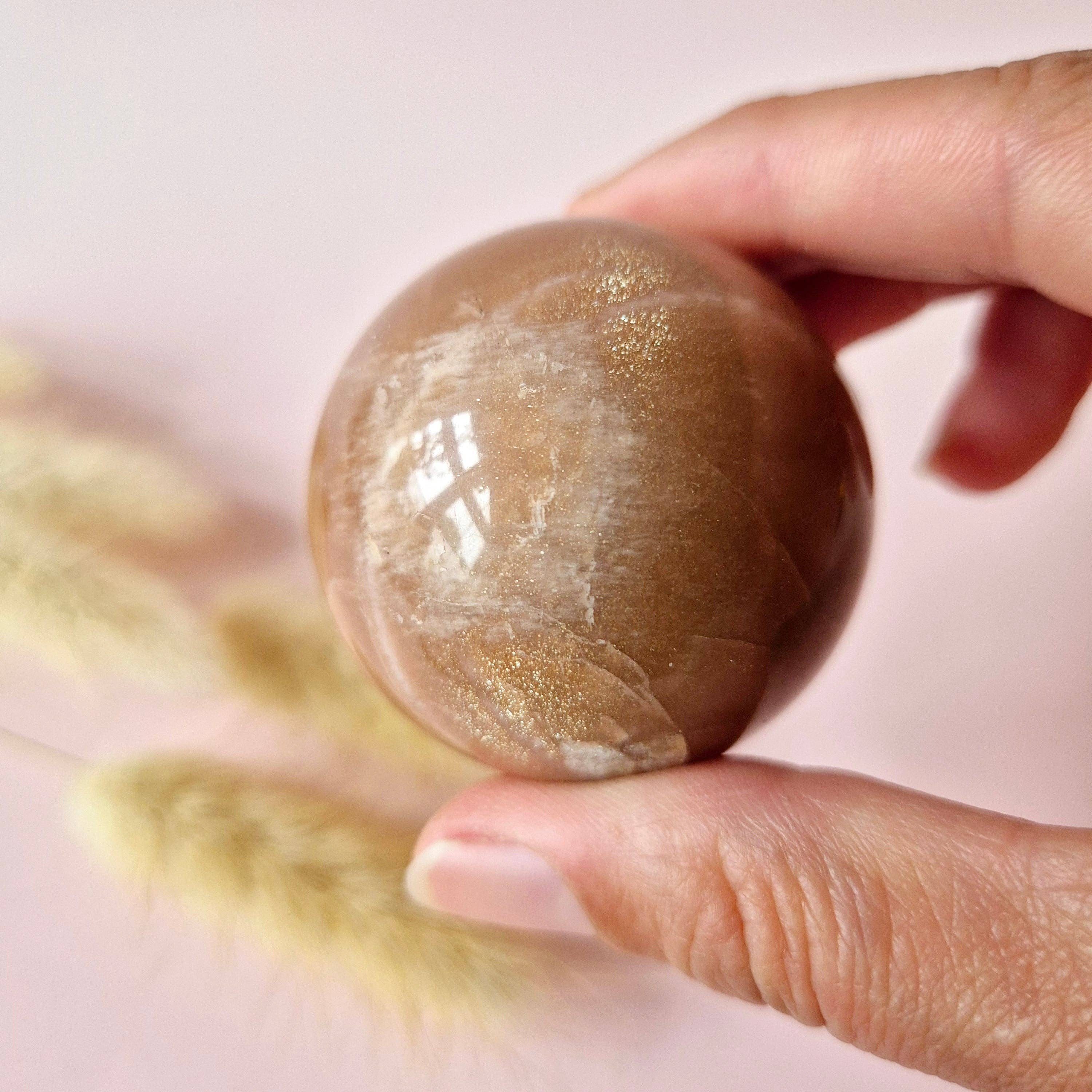 Moonlight Gemstones - Wholesale Spiritual Stone/Crystal - Crystal Gemstone Golden Sunstone Sphere with Blue & Gold Flash | 45–63 mm sphere12