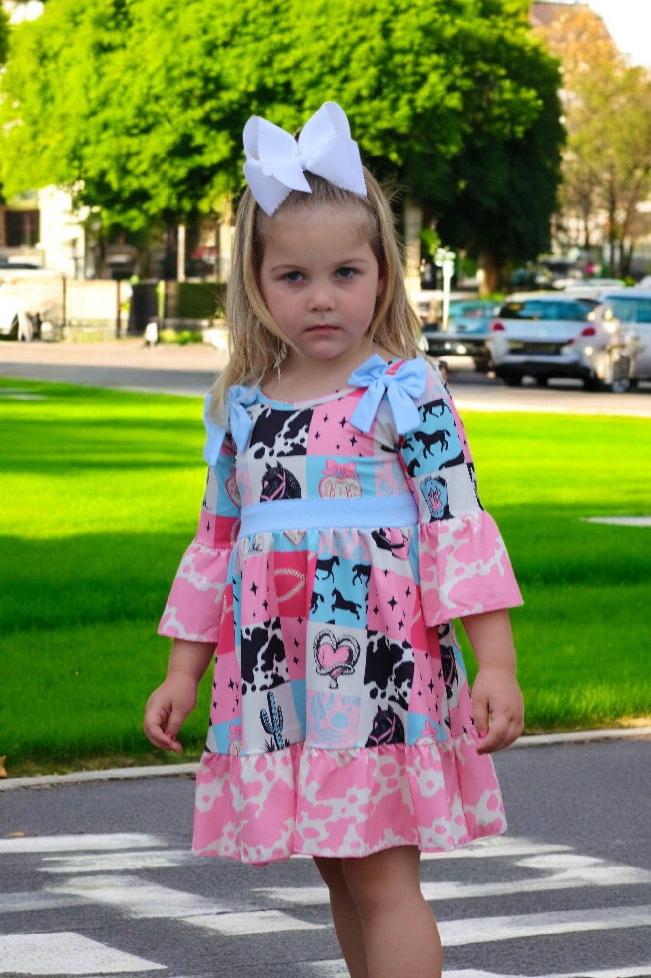 Kids Charm Online - Wholesale Dress - Kids - Beautiful wester patch printed girls dress with bows and cow printed hem.2