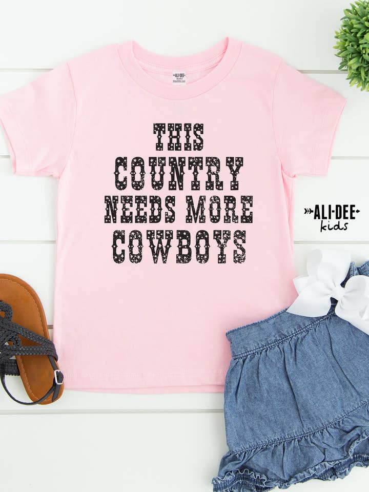 Kids This Country Needs More Cowboys Tee for wholesale by Ali Dee