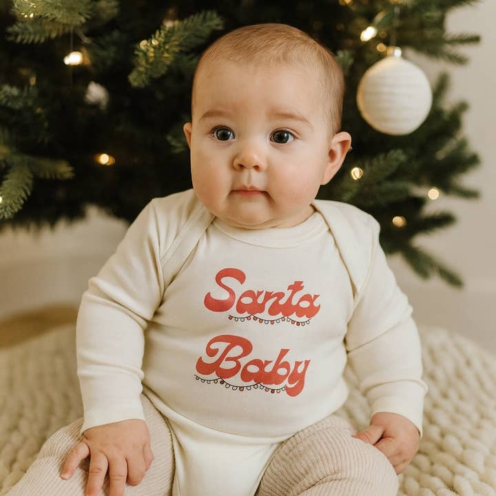 Default Christmas organic long sleeve graphic bodysuit | Santa Baby for wholesale on Faire2