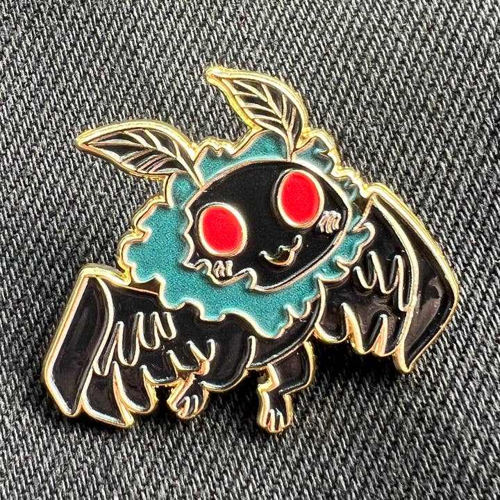 Mothman Baby Enamel Pin for wholesale by Hazy Dell Press