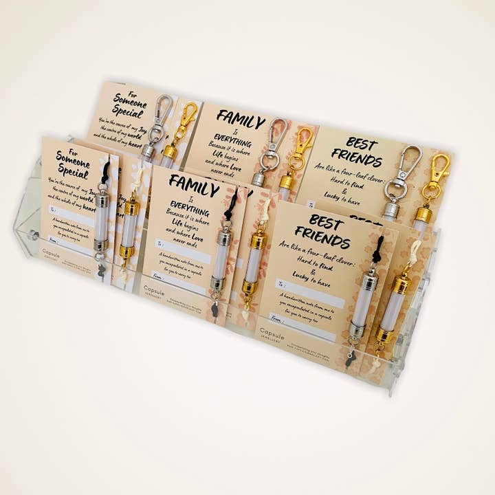 Capsule starter stand pack - blandat armband och nyckelring för wholesale av Capsulet