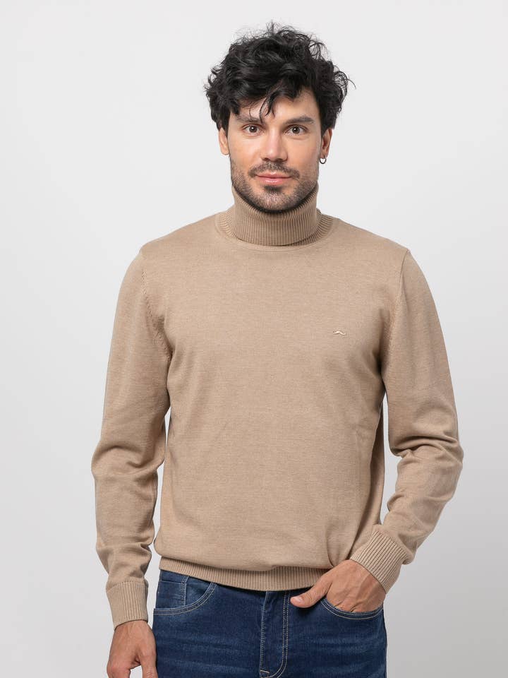 Pull uni col roulé beige s/ tenet pour la vente par Núñez de Arenas
