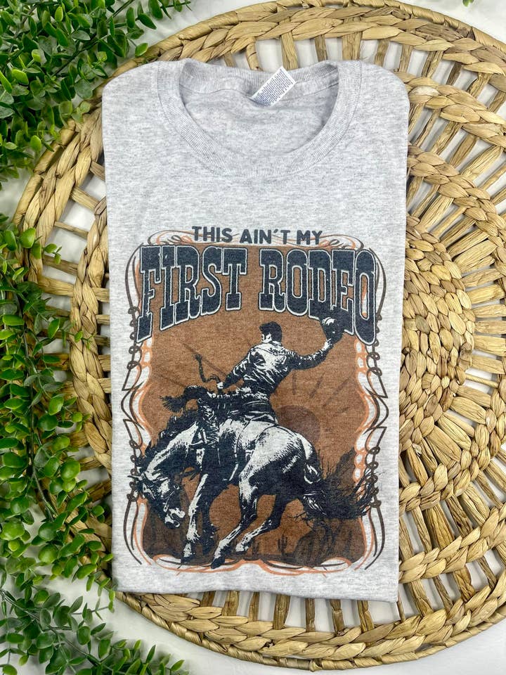 Ash Grey This Ain't My First Rodeo (T-Shirt) for wholesale on Faire0