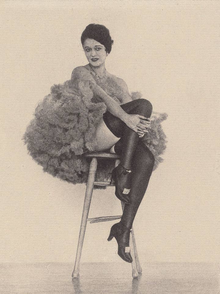 Woman in Can Can Costume sitting on a stool by Arthur F. Kales c.1920 for wholesale by Flashback Shop