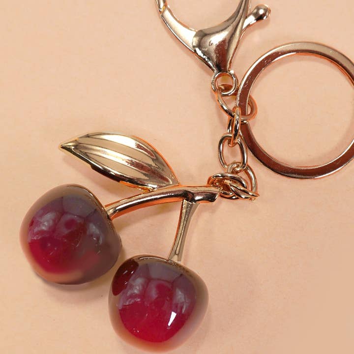 Gold SHINY CHERRY DROP WITH LEAF KEYCHAIN BAG CHARM | 40KC126 for wholesale on Faire0