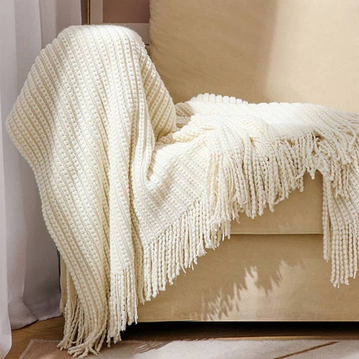 KNITTED SOFT BLANKET WITH TASSELS_CWMM0206 for wholesale by Lovenne