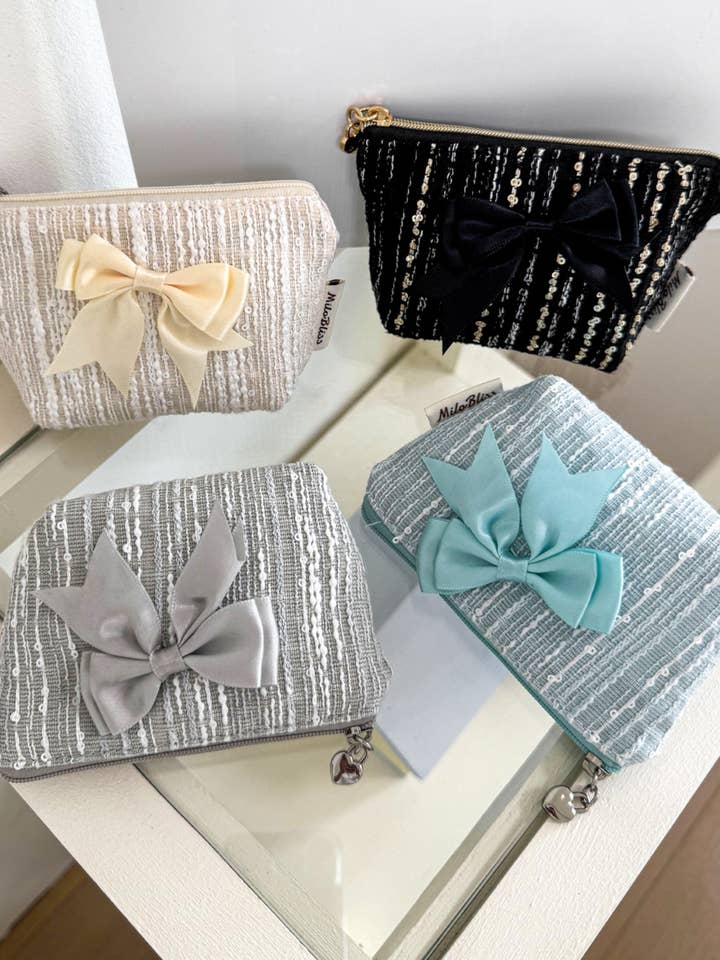 Borsellino con fiocco civettuolo e paillettes per la vendita all'ingrosso da parte di Lane & Lily