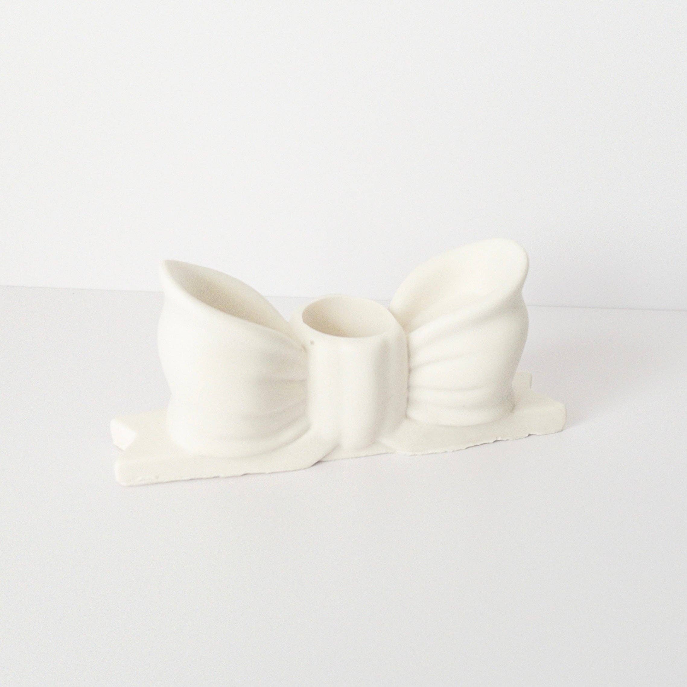 Blanco Bow Candlestick Holder for wholesale on Faire1