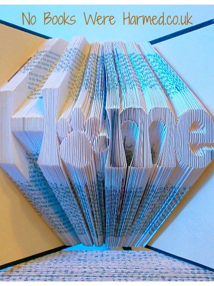 "Home" with paw print Hand Folded Book Art Sculpture Gift for wholesale by No Books Were Harmed.co.uk