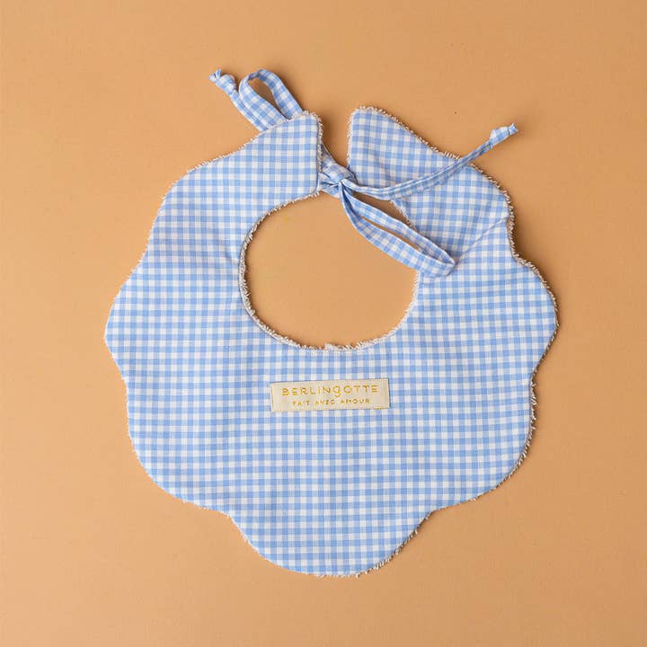 Sky blue gingham The Marguerite bib for wholesale on Faire1