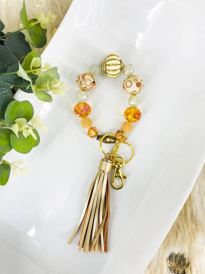 Glass Bead Bracelet Keychain with Gold Tassel for wholesale by Magnolia & Peach Jewelry Boutique, LLC