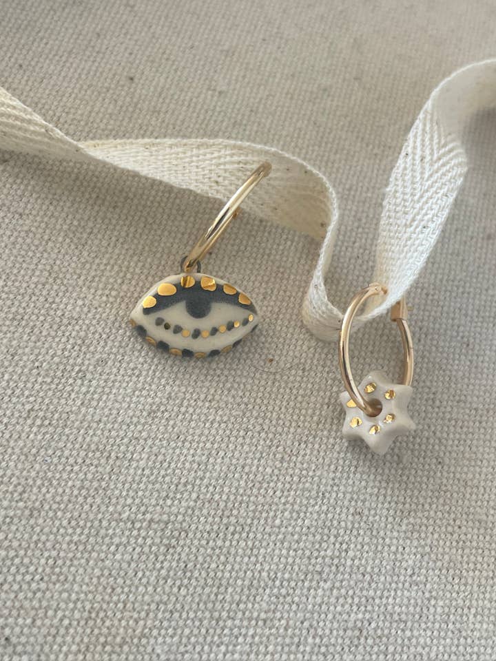 mismatched Eye + Star earrings for wholesale by Carola Spitzer