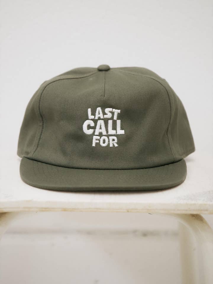 Cappello verde oliva «Last Call For» in cotone per la vendita all'ingrosso da parte di Last Call For