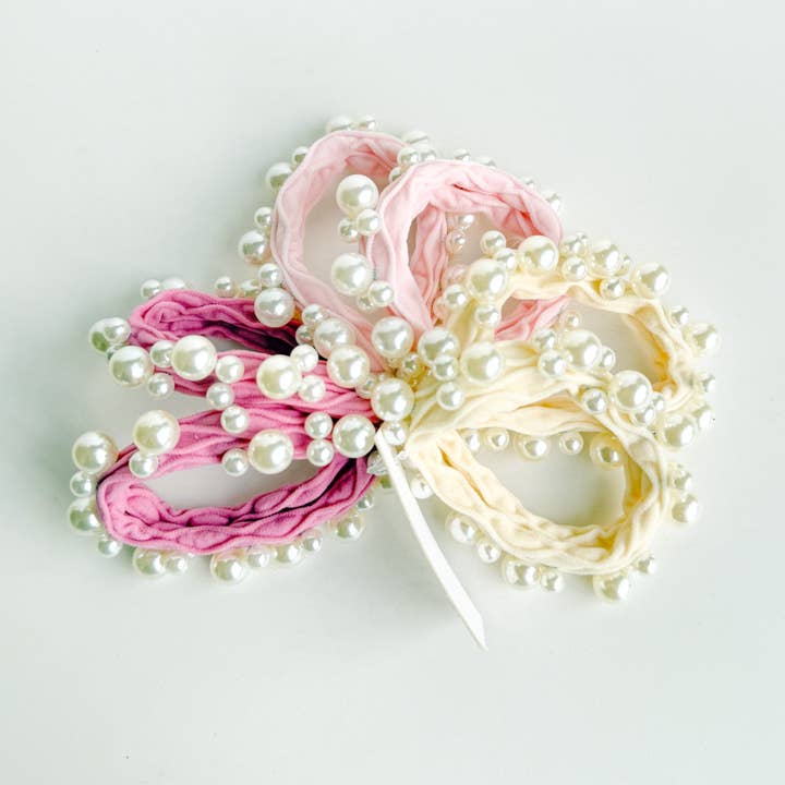 Assorted Pink Textured Seamless Pearl Hair Ties (Set of 6) for wholesale on Faire1