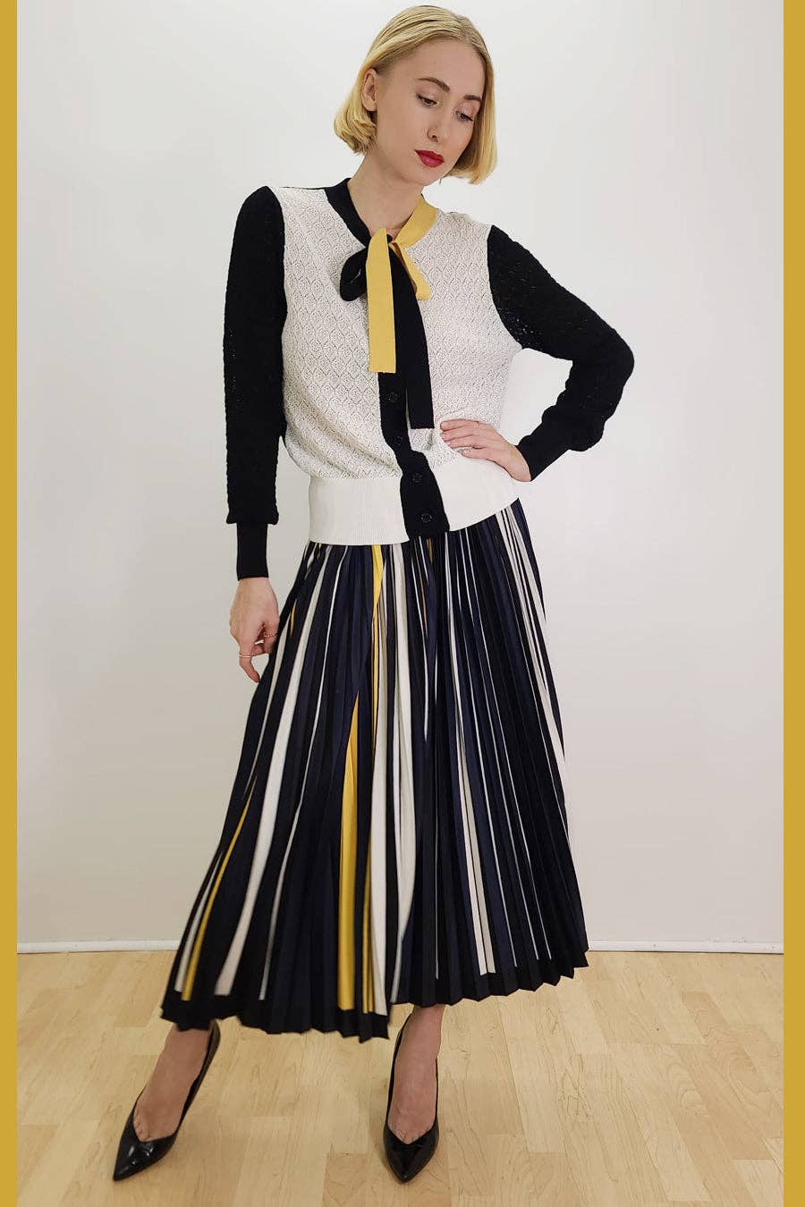 MULTI X7506 MULTICOLOR PLEATED MIDI SKIRT for wholesale on Faire