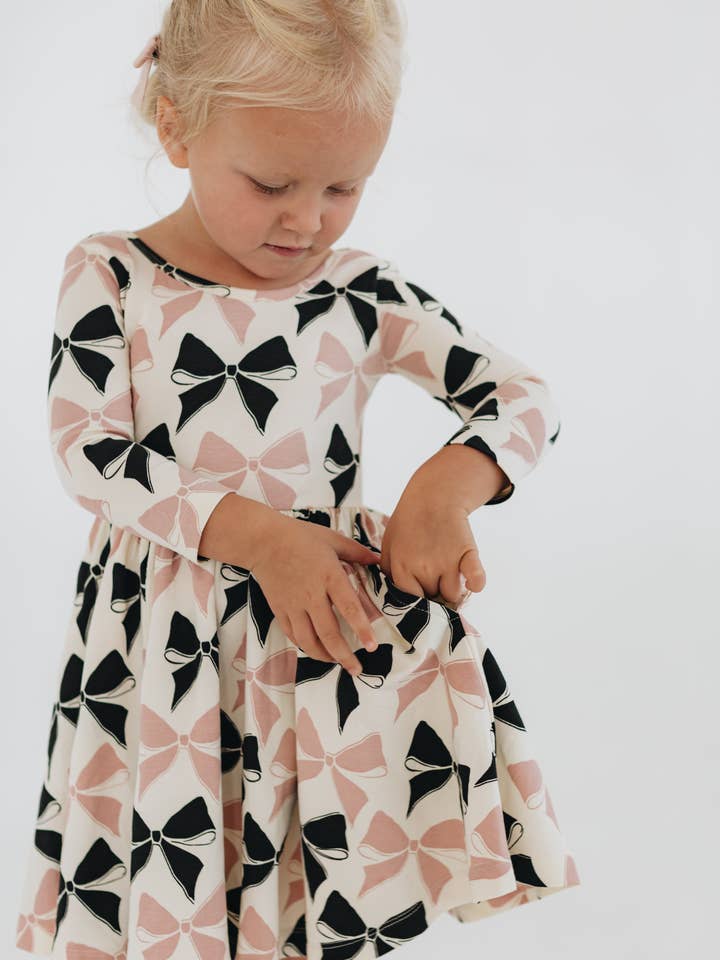 3/4 Sleeve Twirl Dress in Vintage Pink and Black Bows for wholesale by Good Apples Kids