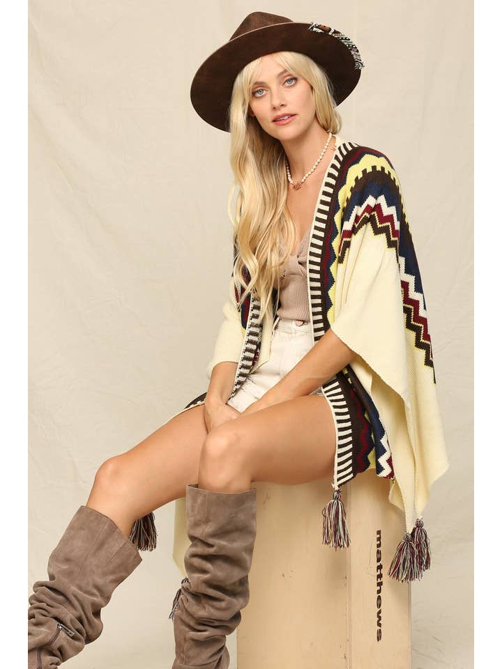 Ivory This Cozy Poncho A Boldly Printed With Tassels for wholesale on Faire3