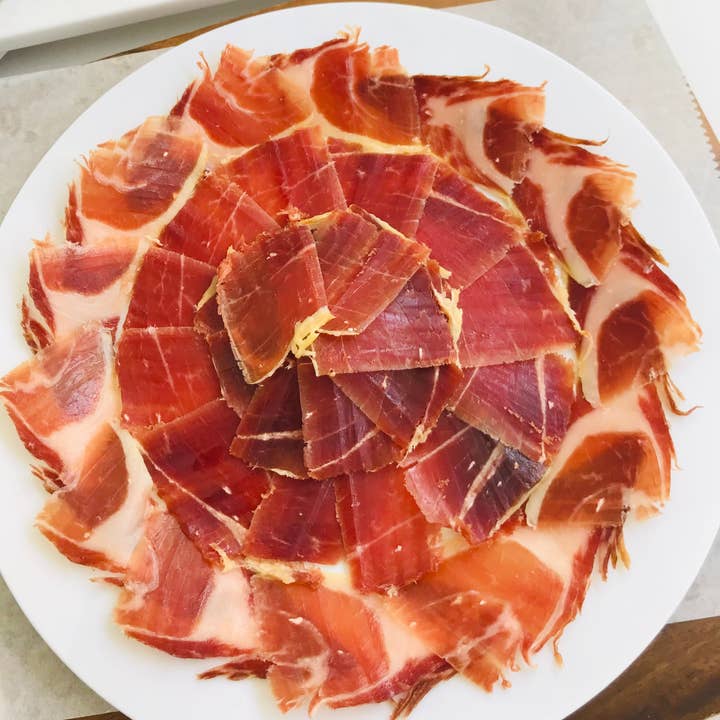 Hand carved Pasture raised 100% Ibérico Pork Ham 2.5oz Plate for wholesale by LA JAMOTECA
