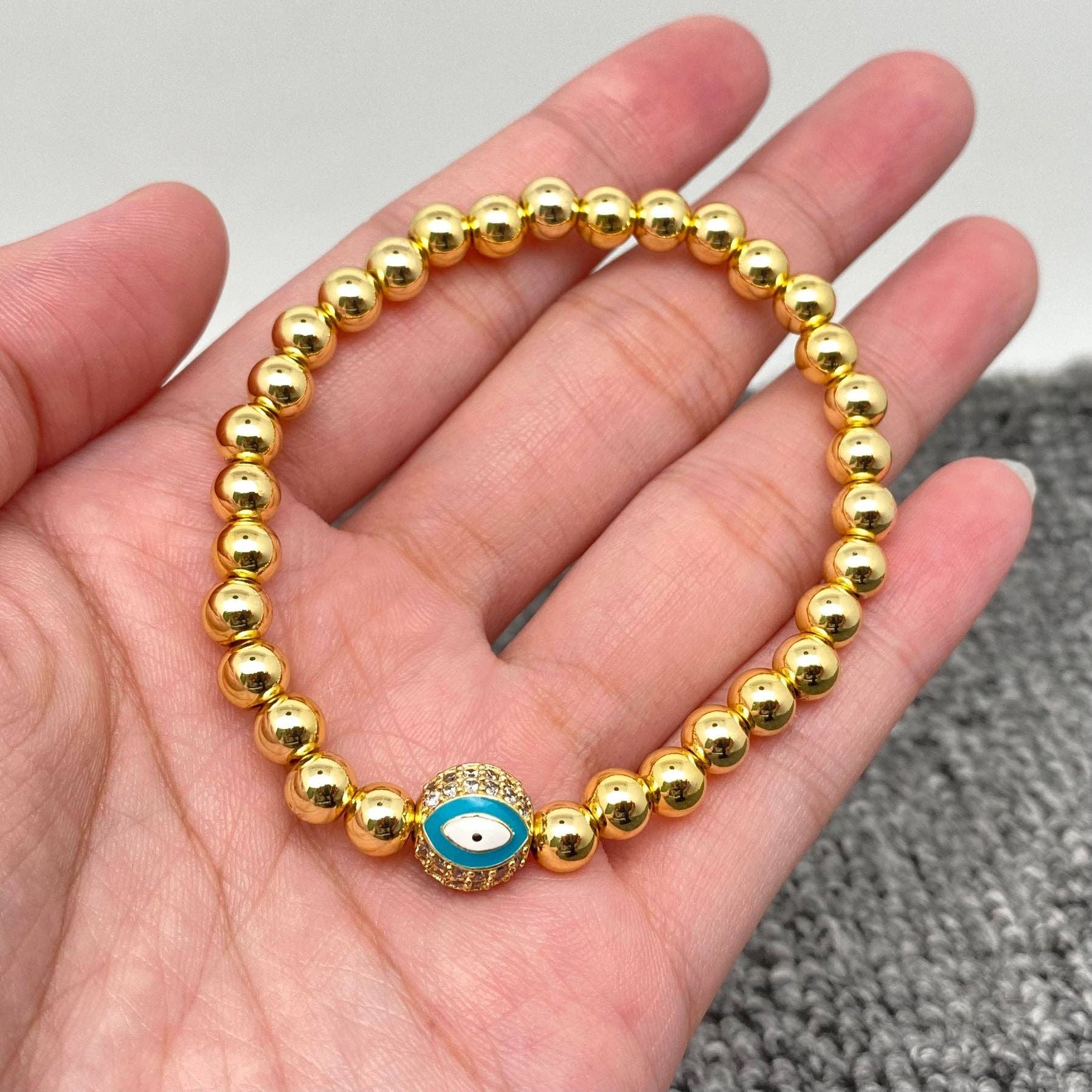 Mio Queena - Wholesale Charm/Dangle Bracelet - Triple Evil Eyes Ball Charm14K Gold Plated Elastic Bracelet0