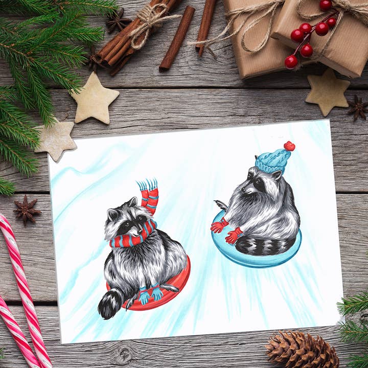 Sardines Studio - Wholesale Christmas Card - Raccoons sliding Greeting Card
