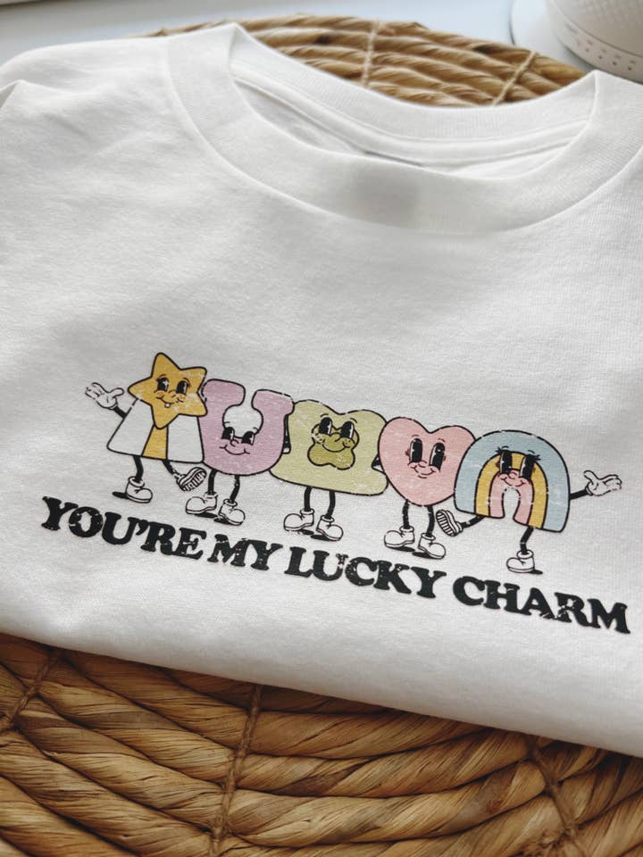 Luck Charm Graphic Shirt | St. Patrick's Day | Cereal for wholesale by The Simple Mom Co
