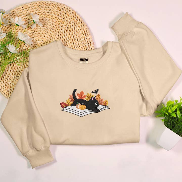 Halloween Cat Book Embroidered Sweatshirt with Bats for wholesale by Stitchchemy