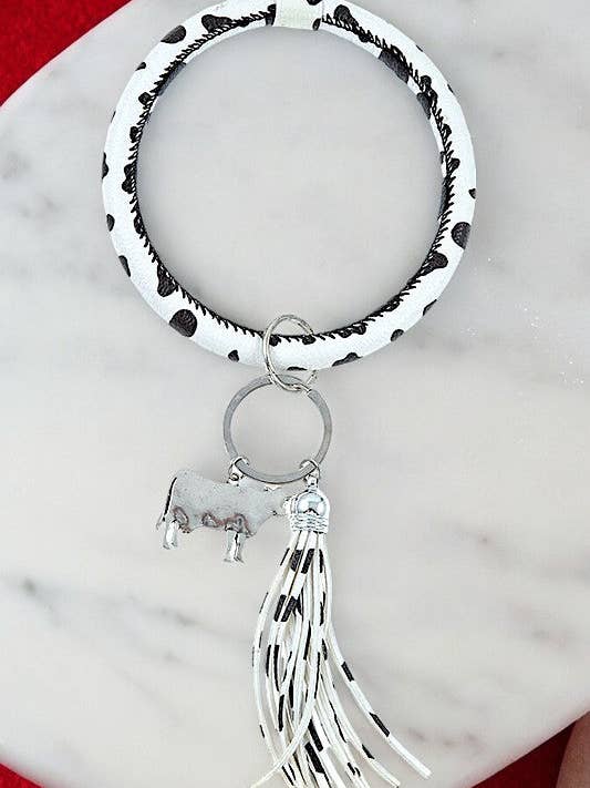 CHAVEIRO COM BORLA COM ESTAMPA DE VACA por atacado de Andrea Bijoux