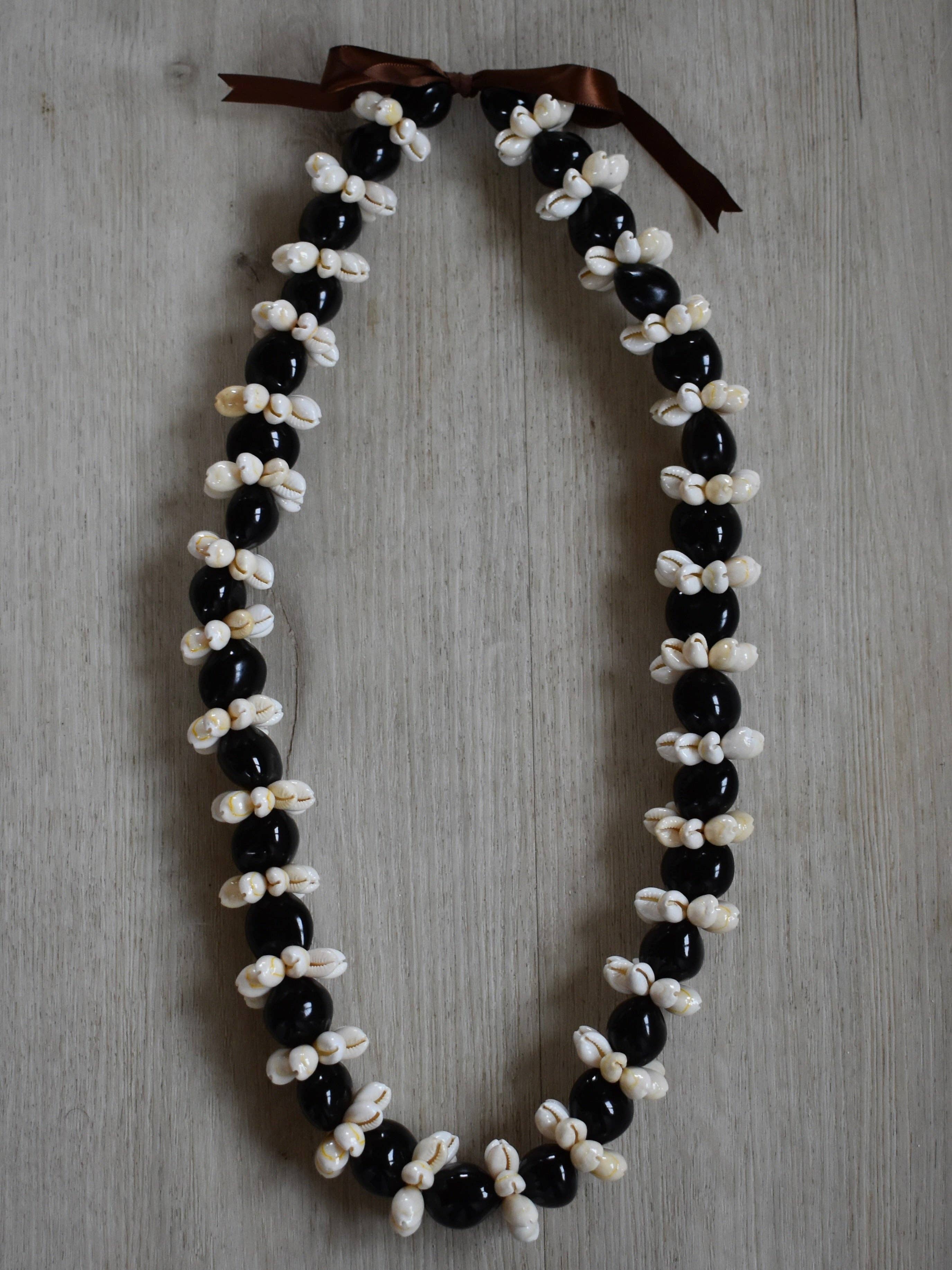 Revel Sun Hawai'i - Wholesale Decorative Tabletop Object - Kukui Nut + Cowrie Shell Lei - Black
