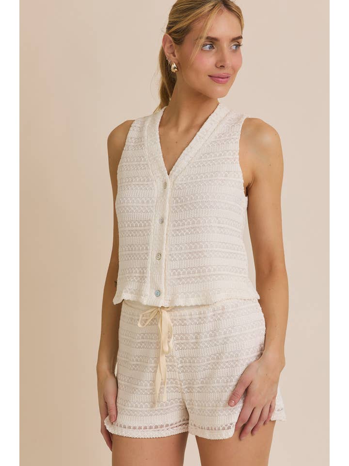 CREAM BUTTON UP SLEEVELESS CROCHET TOP AND WAIST TIE CROCHET SHORT for wholesale on Faire