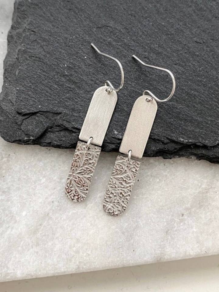 Oval sterling silver dangle, brushed and textured for wholesale by Tina Welsch Jewelry