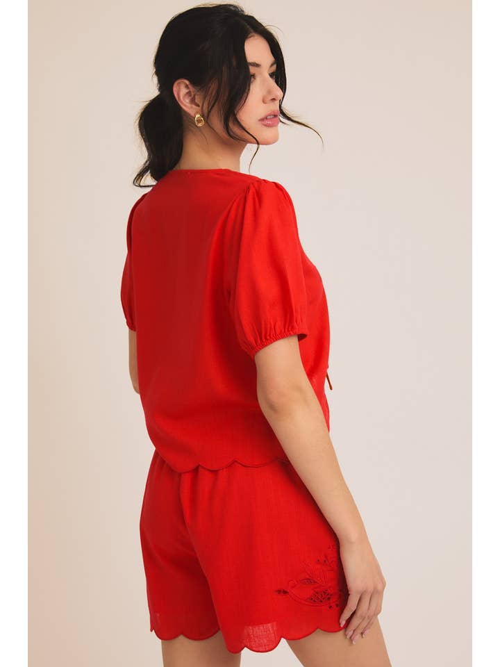 Red EYELET EMBROIDERD FRONT TIES TOP AND SCALLOP SHORTS for wholesale on Faire