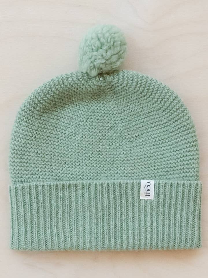 Bonnet pour bébé en laine mérinos en pistache pour la vente par TBCo