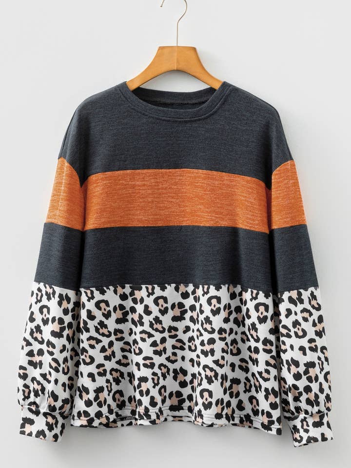 Haut décontracté à manches longues avec empiècement léopard et blocs de couleur noir pour la vente par Sweet Lover Fashion